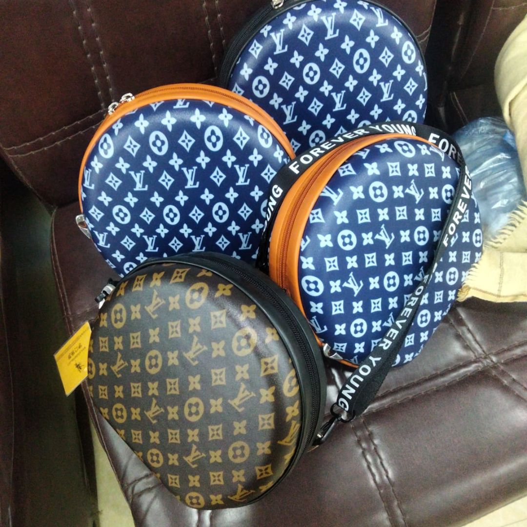 Round shape branded crossbody bag for girls